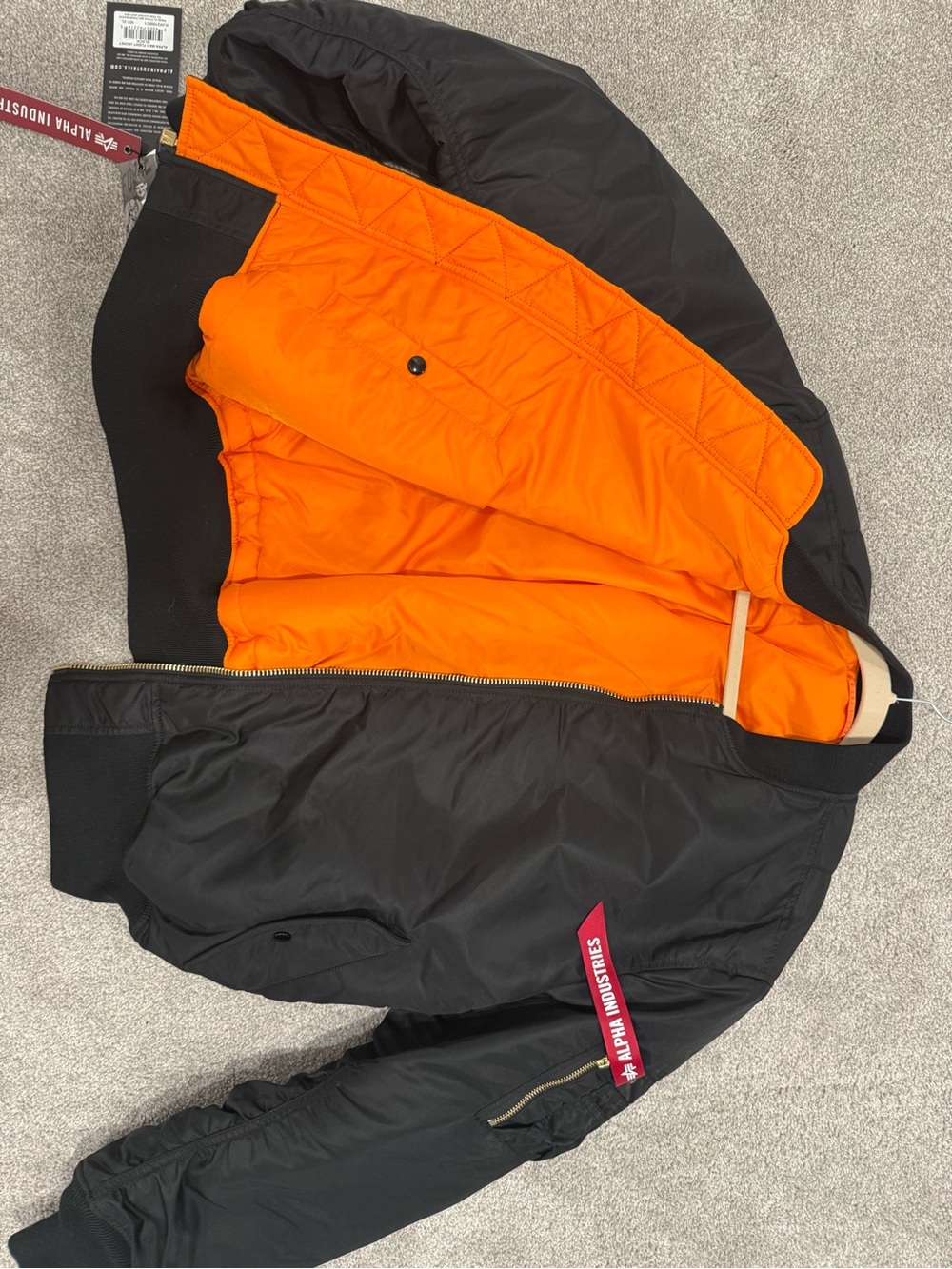 Alpha Industries Black Bomber Jacket with Orange Lining and Red Zip Tag - Picture 5 of 7